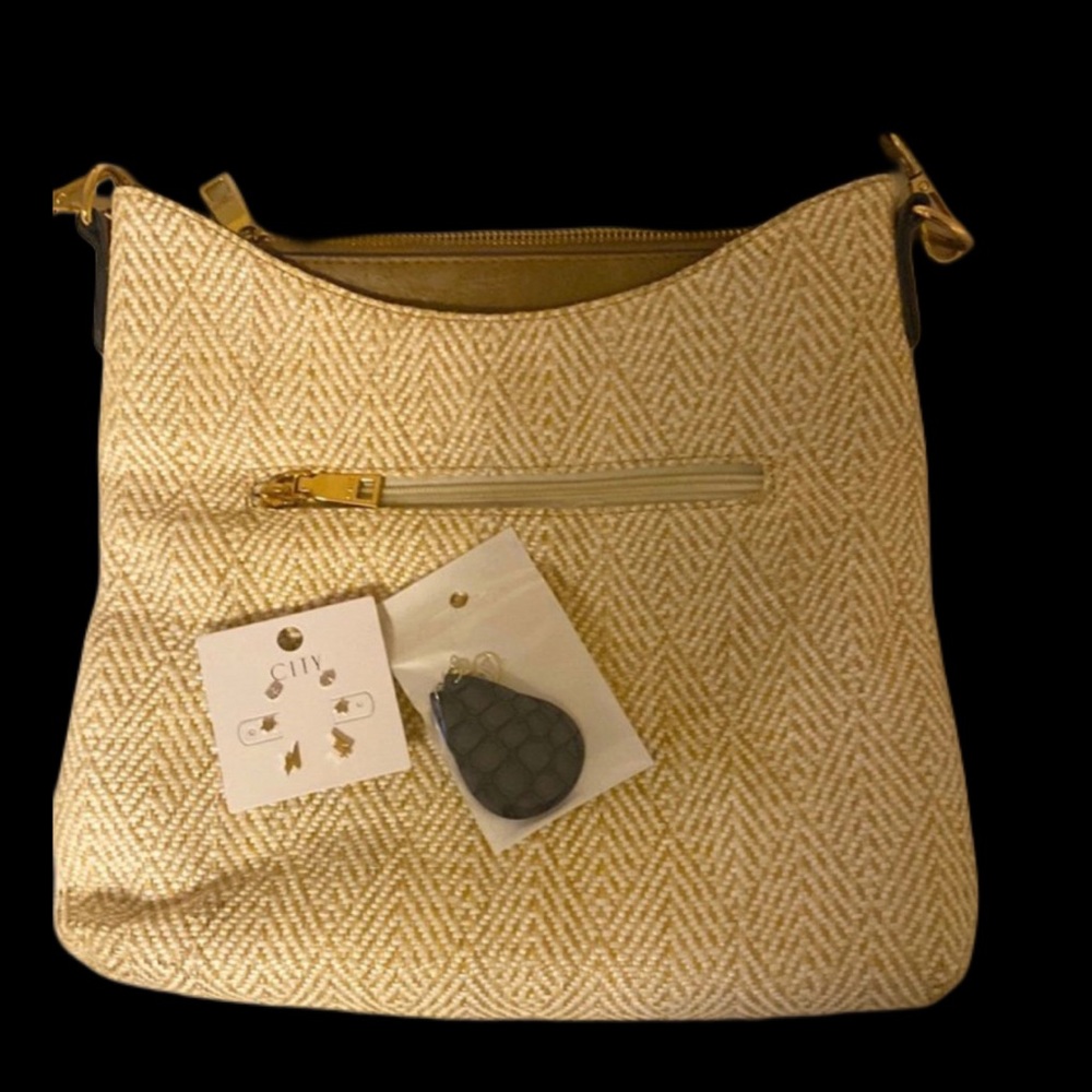 - Like new purse with two pair of FREE earrings